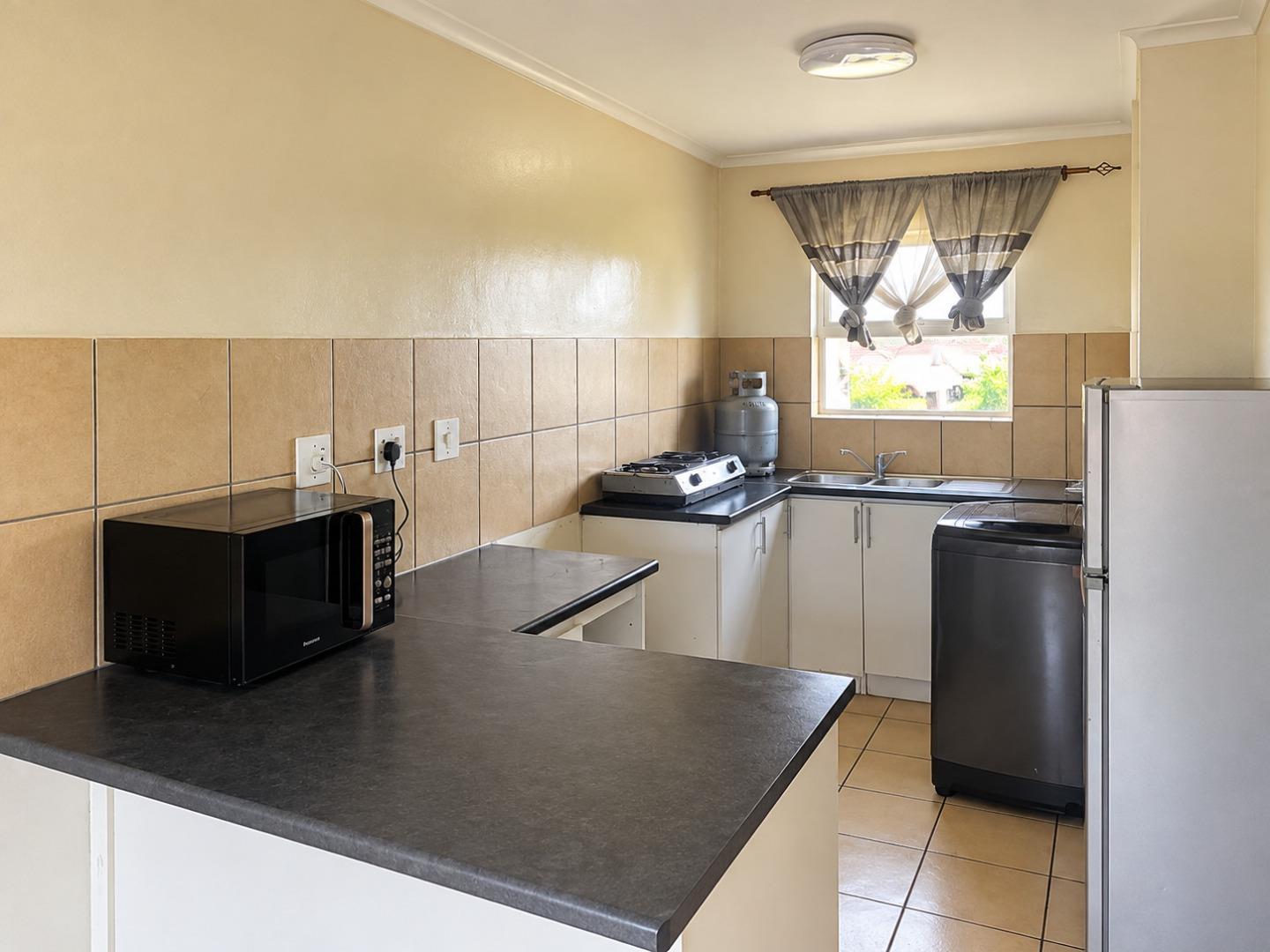 769725_Cozy_Compact_Kitchen_Interior.jpg