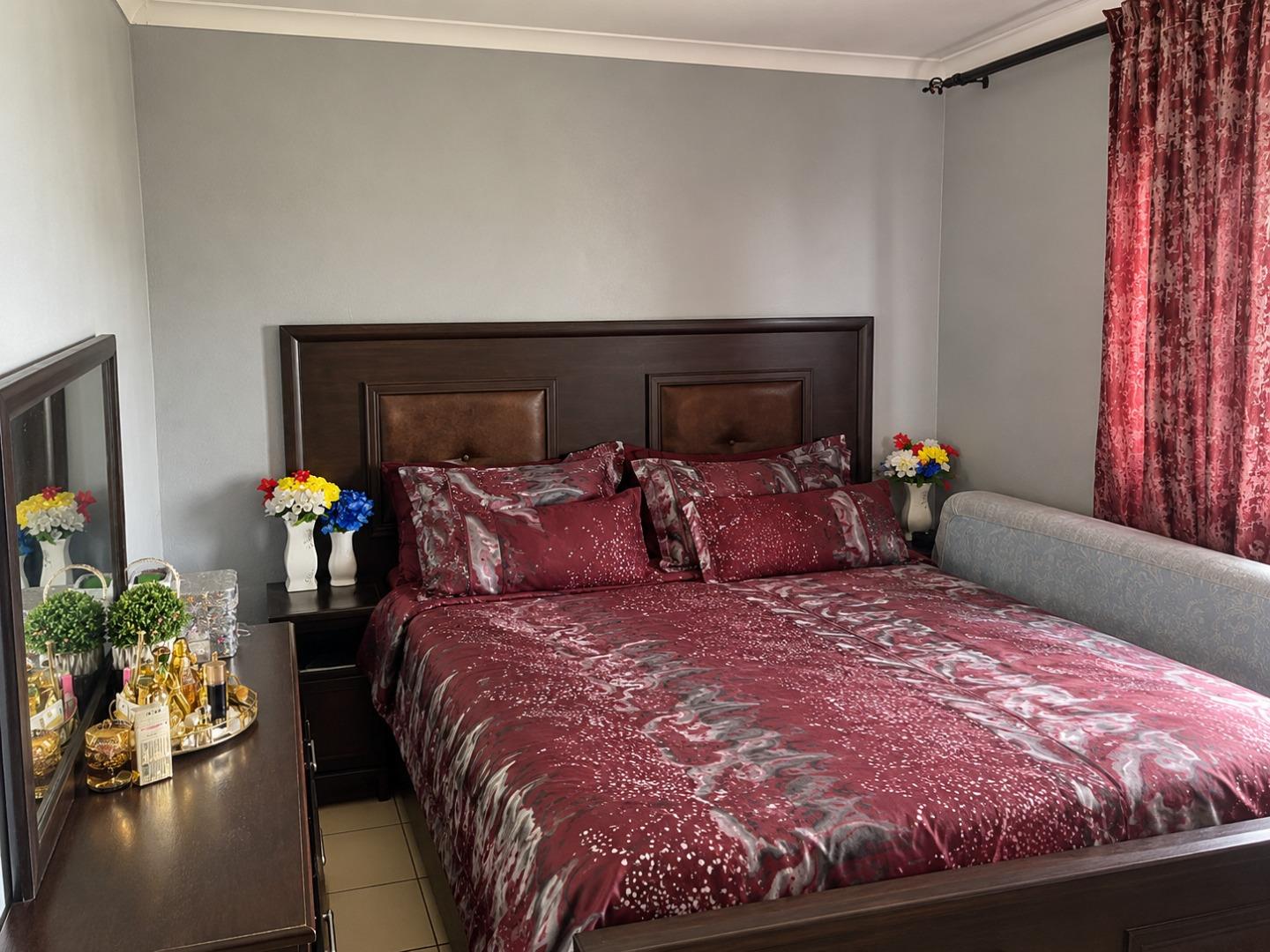 769730_Elegant_Burgundy_Bedroom_Interior.jpg